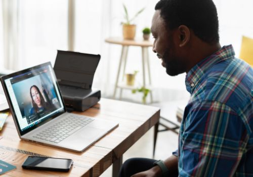 Woman talking to someone in online meeting