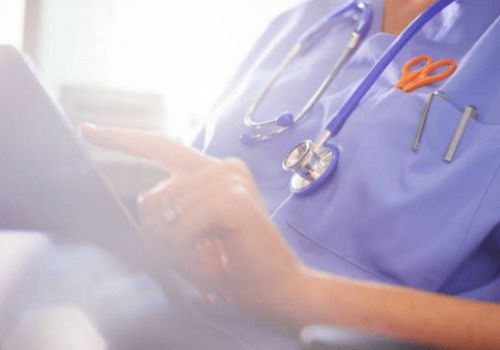 Doctor holding ipad in hospital