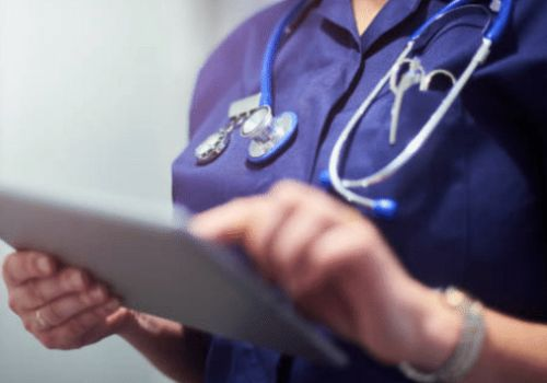 Doctor holding ipad in hospital