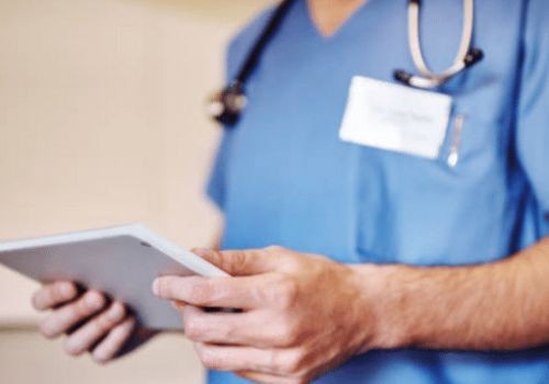 Doctor holding ipad in hospital