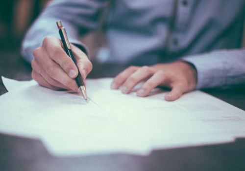 Man signing documents
