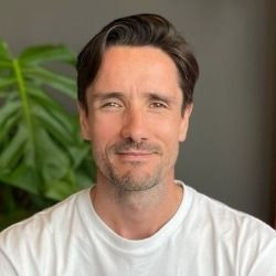Portrait of Ruaidhri MacKay in IMG Connect office