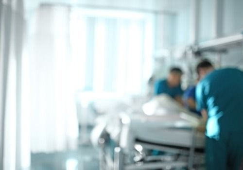 Doctors looking over patient