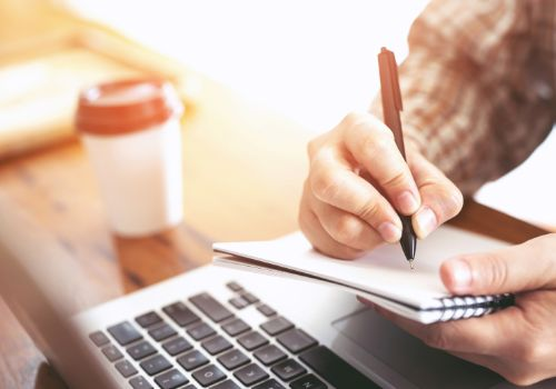Man writing on notepad